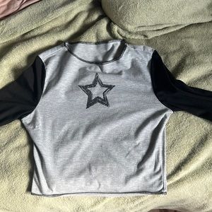 I am selling a y2k black star shirt with little wear